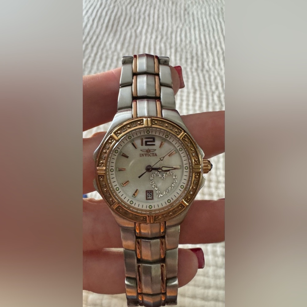 Women's Invicta tritnite watch. Model # 0694.